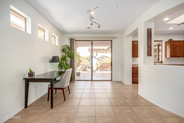 office space featuring light tile patterned floors, baseboards, visible vents, and recessed lighting