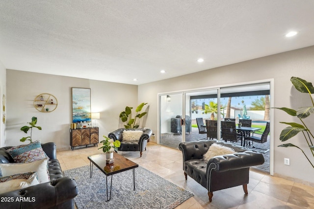 living room featuring light tile patterned floors and a textured ceiling