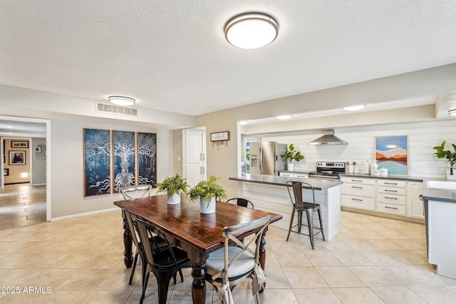 dining room with sink and light tile patterned floors