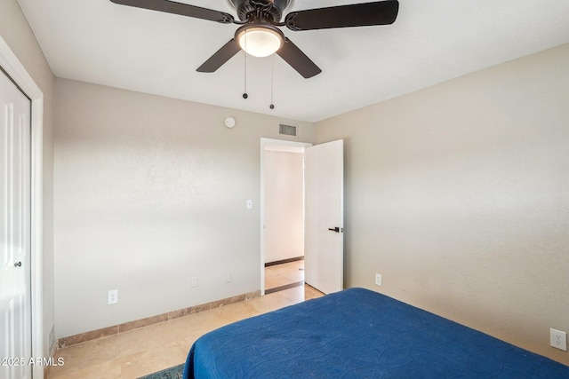 unfurnished bedroom with ceiling fan and light tile patterned flooring