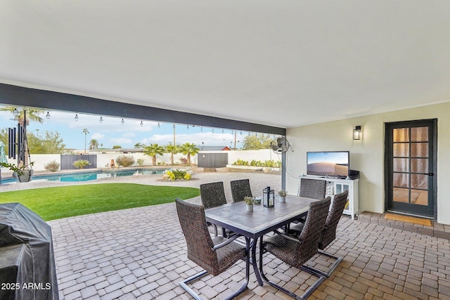 view of patio with a grill and a fenced in pool