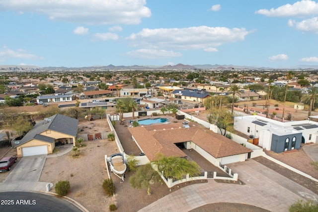 birds eye view of property featuring a mountain view