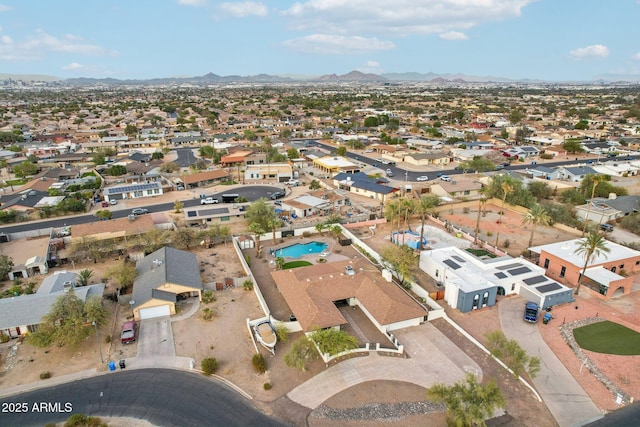 birds eye view of property featuring a mountain view