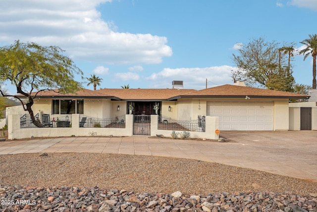 ranch-style home featuring a garage