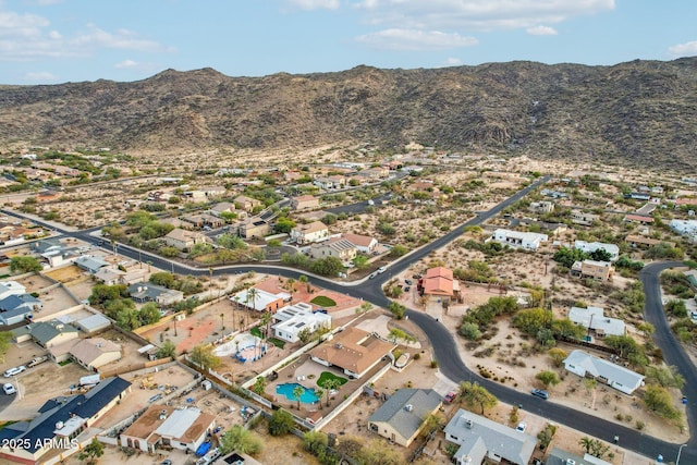 birds eye view of property with a mountain view