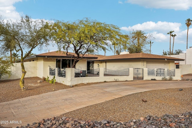 back of house featuring a garage