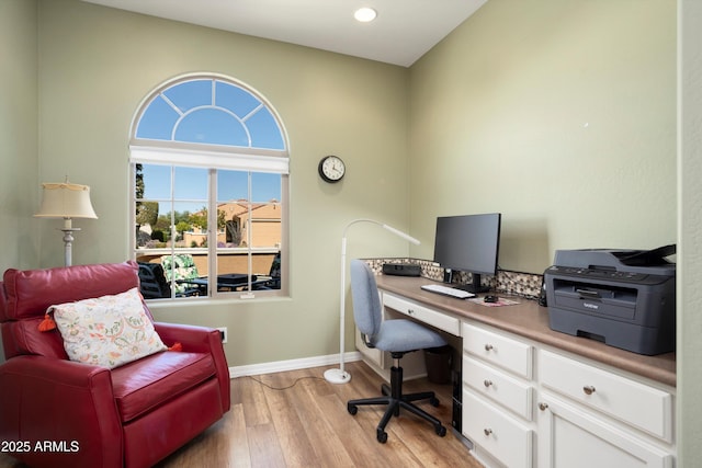 office space featuring recessed lighting, baseboards, and light wood finished floors