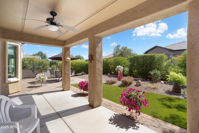 view of patio featuring ceiling fan and a fenced backyard