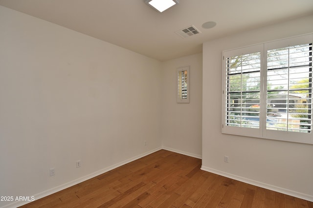 spare room featuring hardwood / wood-style flooring