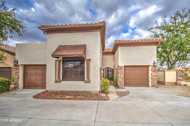 view of front of house featuring stone siding, stucco siding, driveway, and a garage