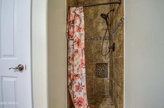 bathroom with a shower stall