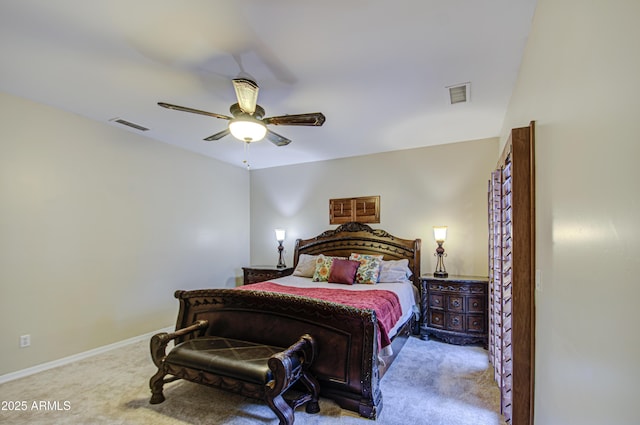 carpeted bedroom with visible vents, baseboards, and a ceiling fan