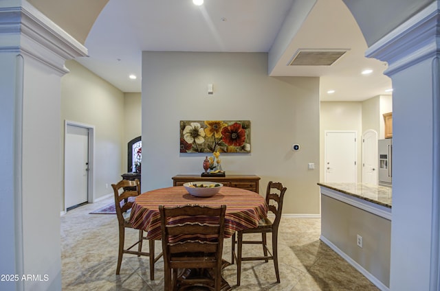 dining space featuring recessed lighting, baseboards, visible vents, and ornate columns