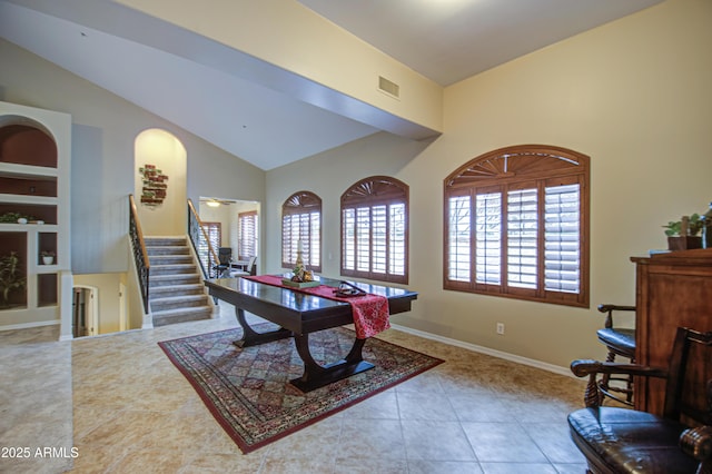 rec room with built in features, baseboards, visible vents, lofted ceiling, and tile patterned floors