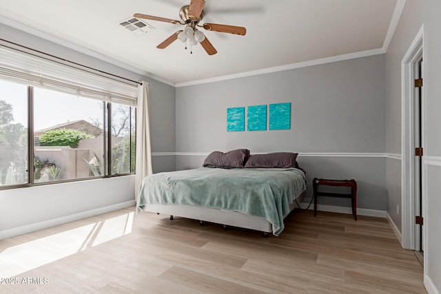 9225 W Clara Ln, Peoria, AZ 85382 - bedroom with ornamental molding, visible vents, baseboards, and light wood-style floors