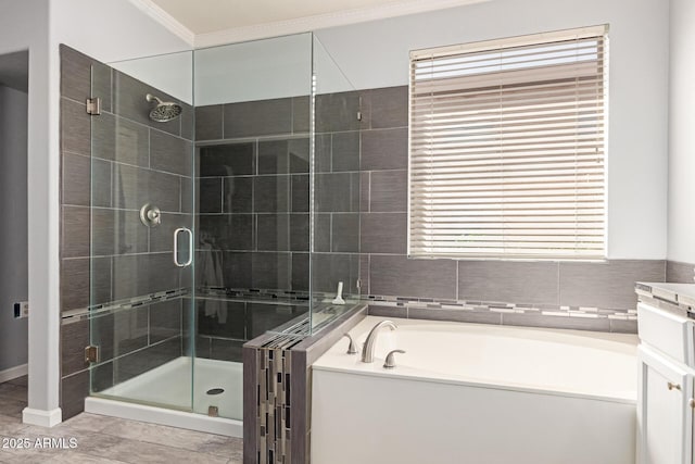 9225 W Clara Ln, Peoria, AZ 85382 - bathroom featuring a garden tub, a stall shower, and crown molding