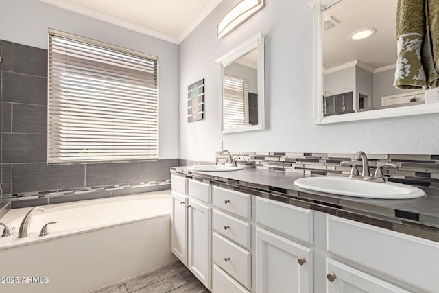 9225 W Clara Ln, Peoria, AZ 85382 - full bath featuring double vanity, a garden tub, a sink, and crown molding