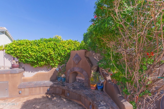 9225 W Clara Ln, Peoria, AZ 85382 - view of patio with fence and exterior fireplace