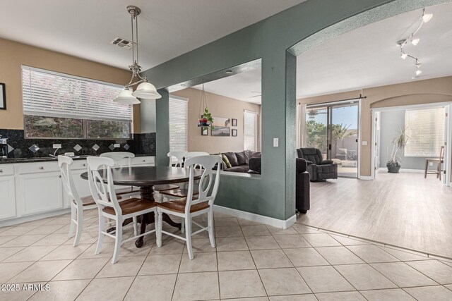 9225 W Clara Ln, Peoria, AZ 85382 - dining space featuring light tile patterned floors, visible vents, and baseboards