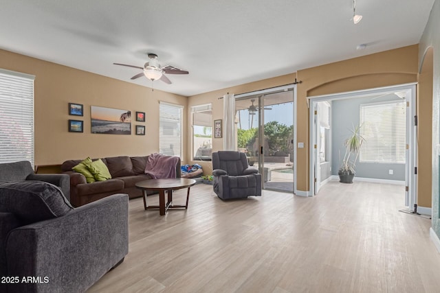 9225 W Clara Ln, Peoria, AZ 85382 - living room featuring baseboards, a ceiling fan, and light wood-style floors