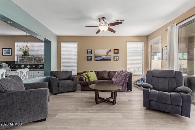 9225 W Clara Ln, Peoria, AZ 85382 - living area with visible vents, ceiling fan, and light wood-style floors