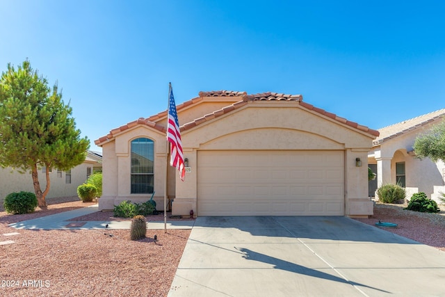 mediterranean / spanish-style house featuring a garage