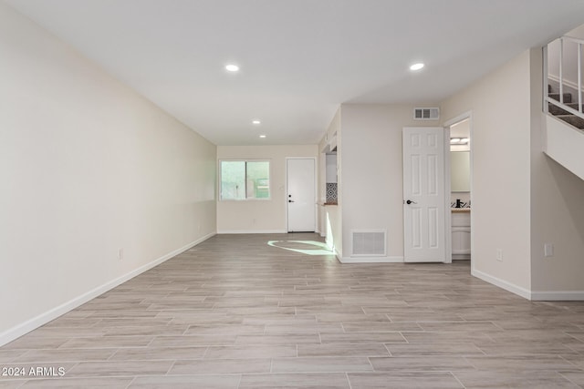 unfurnished living room featuring light hardwood / wood-style floors