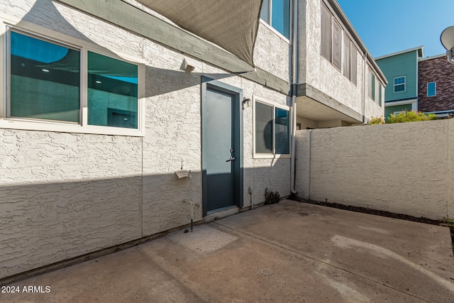 view of side of home featuring a patio