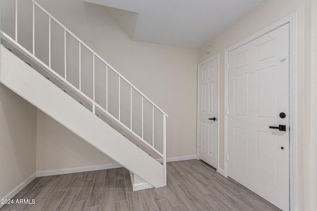 entryway with light hardwood / wood-style floors