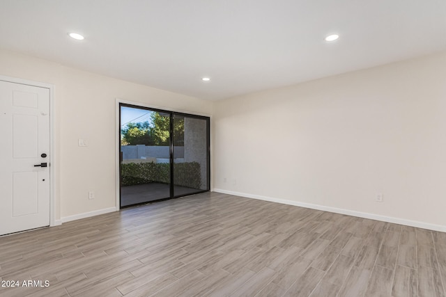 empty room with light hardwood / wood-style floors