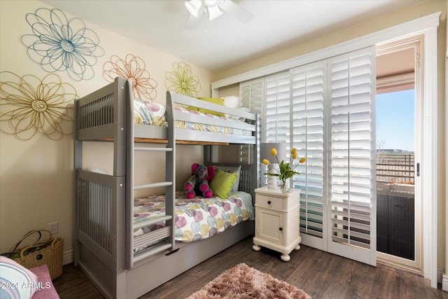 bedroom with dark hardwood / wood-style flooring and ceiling fan