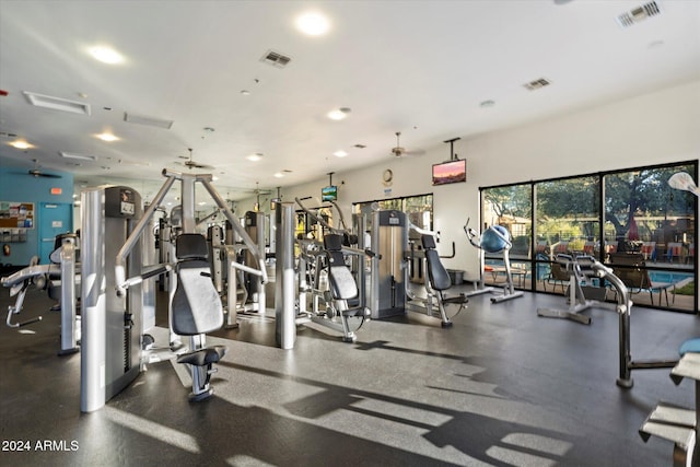 exercise room with ceiling fan