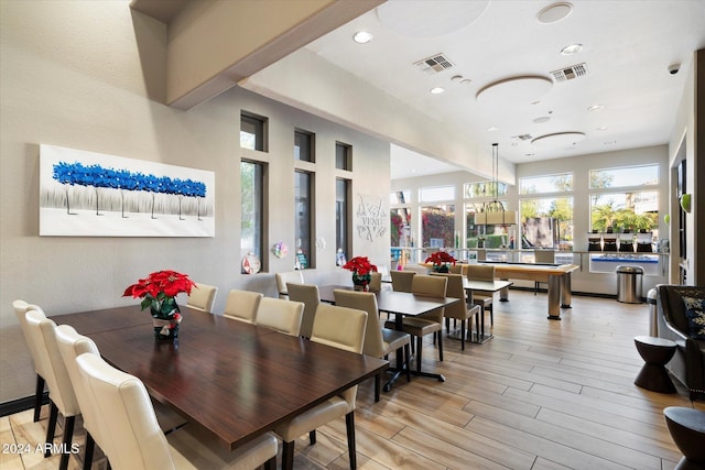 dining space with light hardwood / wood-style flooring