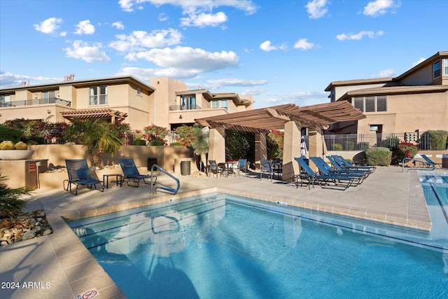 view of pool with a pergola and a patio area