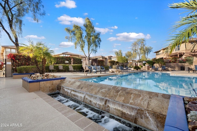 view of swimming pool with a patio