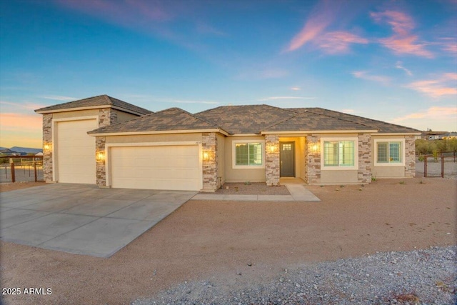 28319 N Marchant Trce, Queen Creek, AZ 85144 - prairie-style home featuring stone siding, a garage, and concrete driveway
