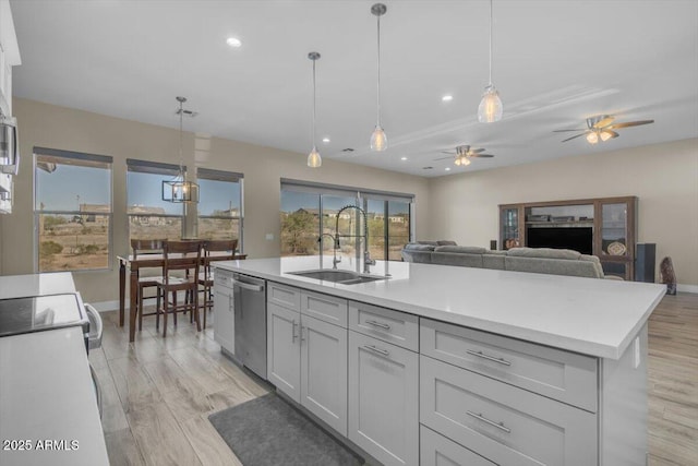 28319 N Marchant Trce, Queen Creek, AZ 85144 - kitchen featuring stainless steel dishwasher, light countertops, ceiling fan, and a sink