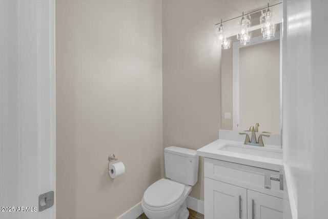 28319 N Marchant Trce, Queen Creek, AZ 85144 - bathroom with baseboards, toilet, and vanity