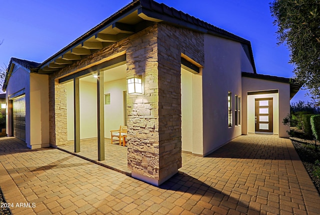 view of side of home with a garage