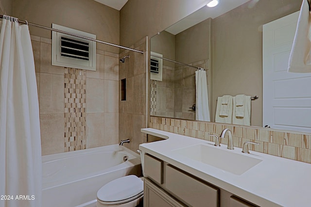 full bathroom with tasteful backsplash, vanity, shower / tub combo, and toilet