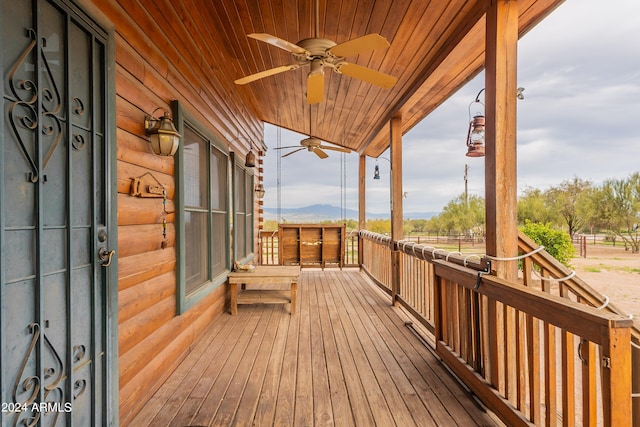 deck with covered porch and ceiling fan