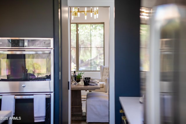 10646 E Butherus Dr, Scottsdale, AZ 85255 - kitchen with appliances with stainless steel finishes and a chandelier