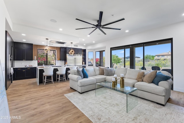 10646 E Butherus Dr, Scottsdale, AZ 85255 - living room featuring light wood finished floors, recessed lighting, and ceiling fan