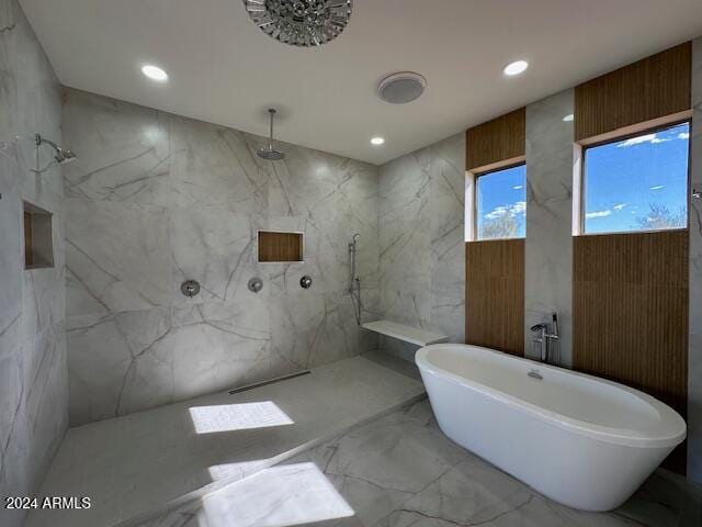 bathroom with shower with separate bathtub