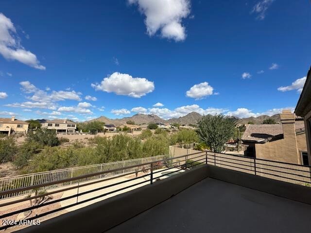 exterior space with a mountain view and a balcony