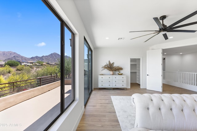 10646 E Butherus Dr, Scottsdale, AZ 85255 - bedroom with a mountain view, wood finished floors, recessed lighting, a walk in closet, and a ceiling fan