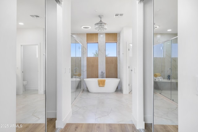 10646 E Butherus Dr, Scottsdale, AZ 85255 - full bathroom with a shower stall, marble finish floors, a freestanding tub, and toilet