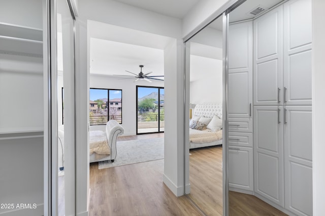 10646 E Butherus Dr, Scottsdale, AZ 85255 - hallway with light wood-style floors