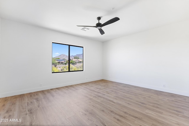 10646 E Butherus Dr, Scottsdale, AZ 85255 - empty room featuring light wood-type flooring, baseboards, and ceiling fan