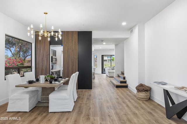 10646 E Butherus Dr, Scottsdale, AZ 85255 - dining area featuring light wood-style floors, a chandelier, baseboards, and recessed lighting